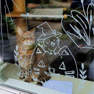 Halloween kat met pompoen raamtekening sjabloon